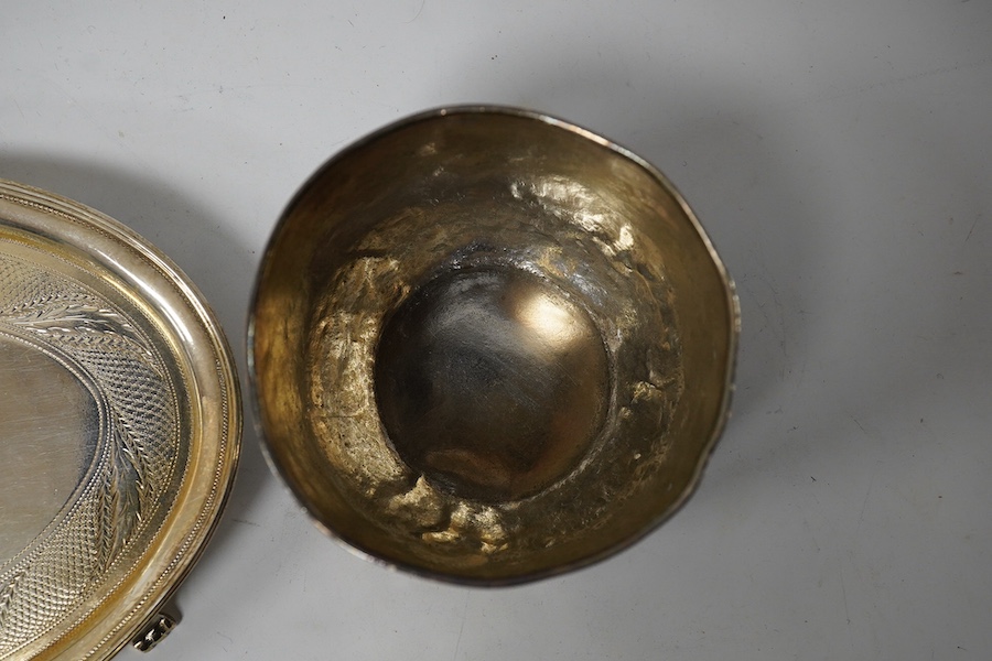 A George III silver teapot stand, by Daniel Pontifex, London, 1796, 16cm and a white metal tumbler cup, gross 180 grams. Condition - poor and good